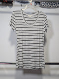 A short-sleeve scoop-neck t-shirt with thin horizontal gray and white stripes, hanging on a white plastic hanger on a clothing rack.