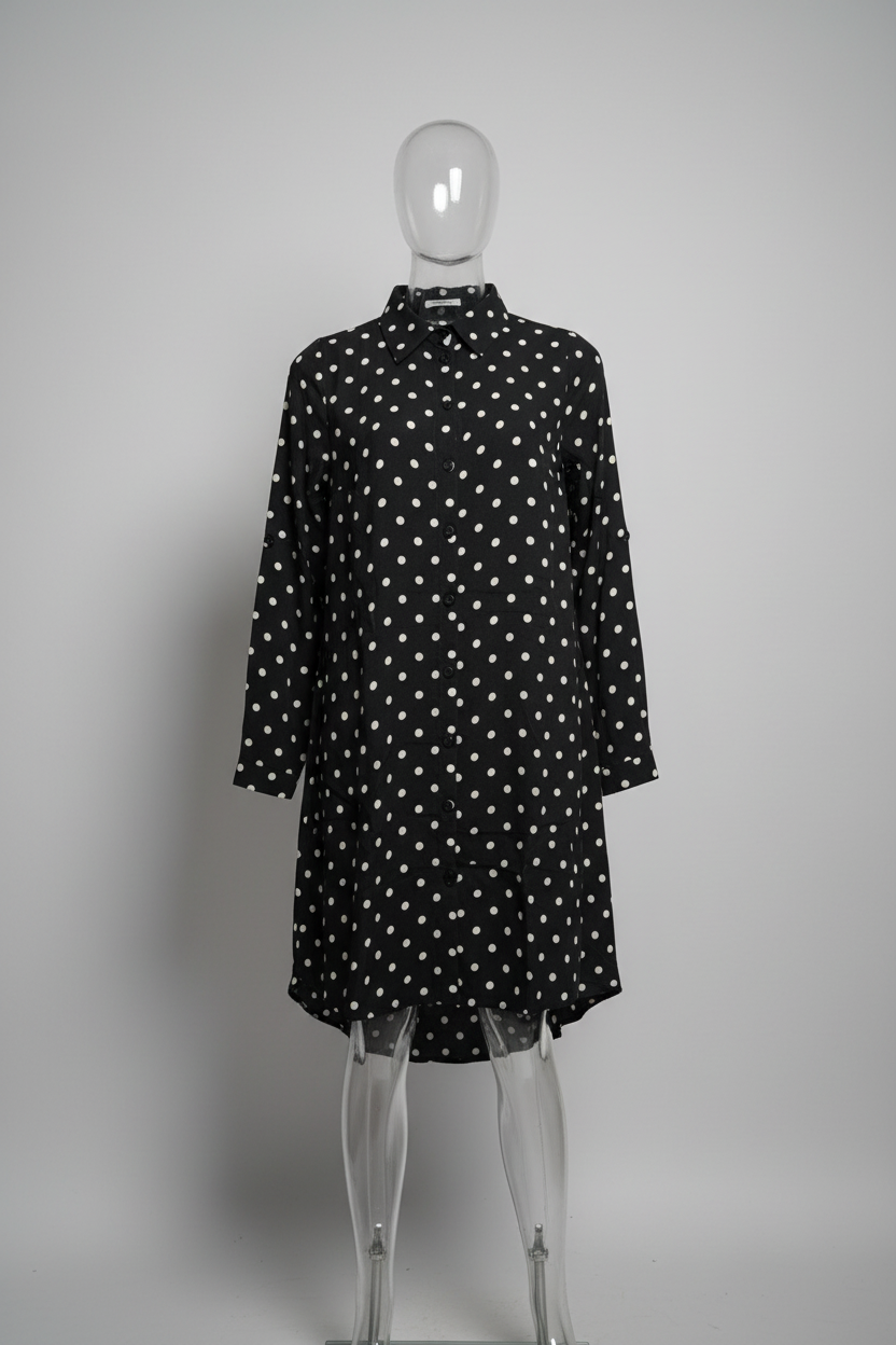 A black long-sleeve dress with a white polka-dot pattern, displayed on a clear acrylic mannequin against a neutral gray background.