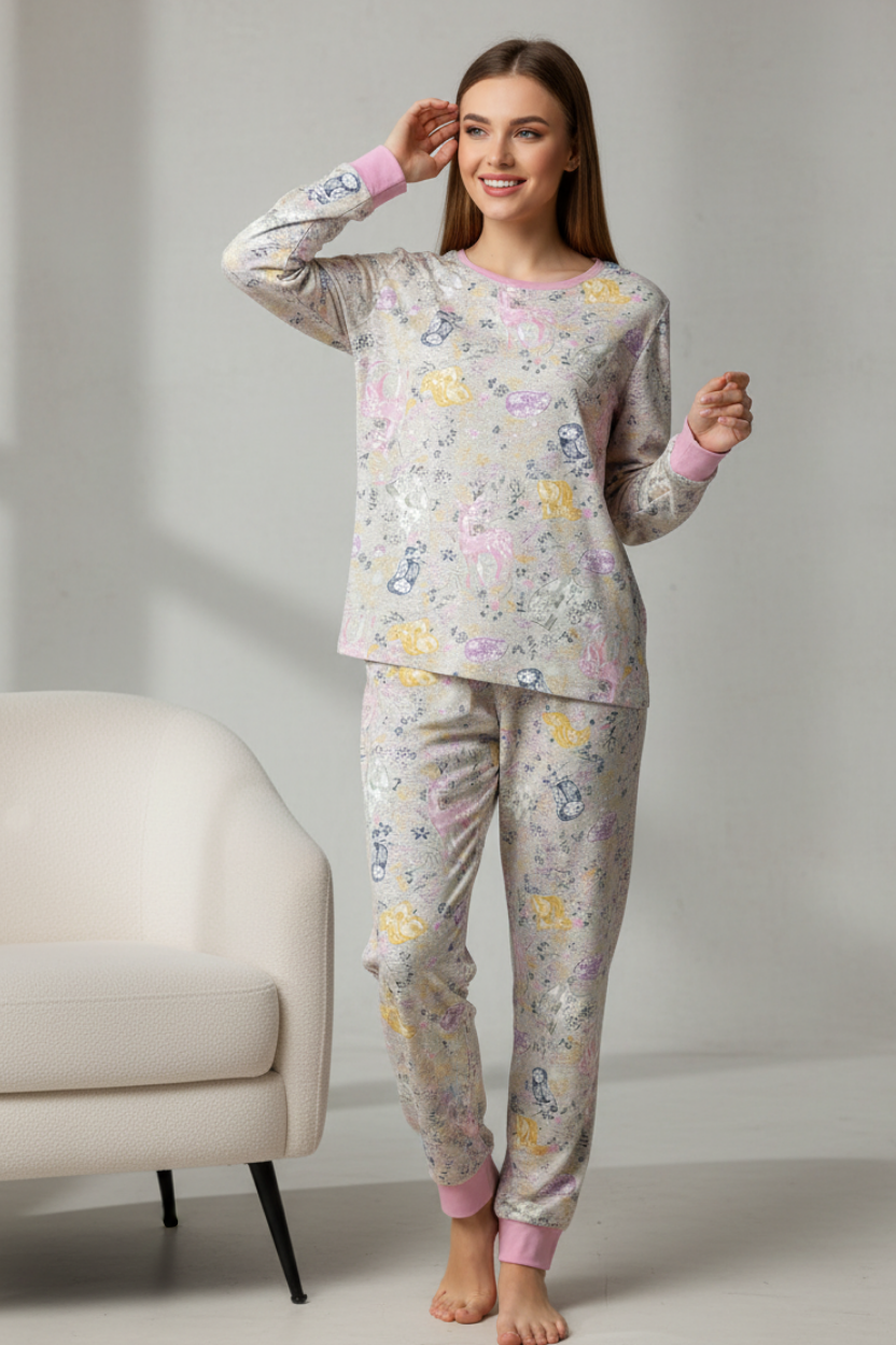 Floral pajama set hanging on a rack against a white wall.