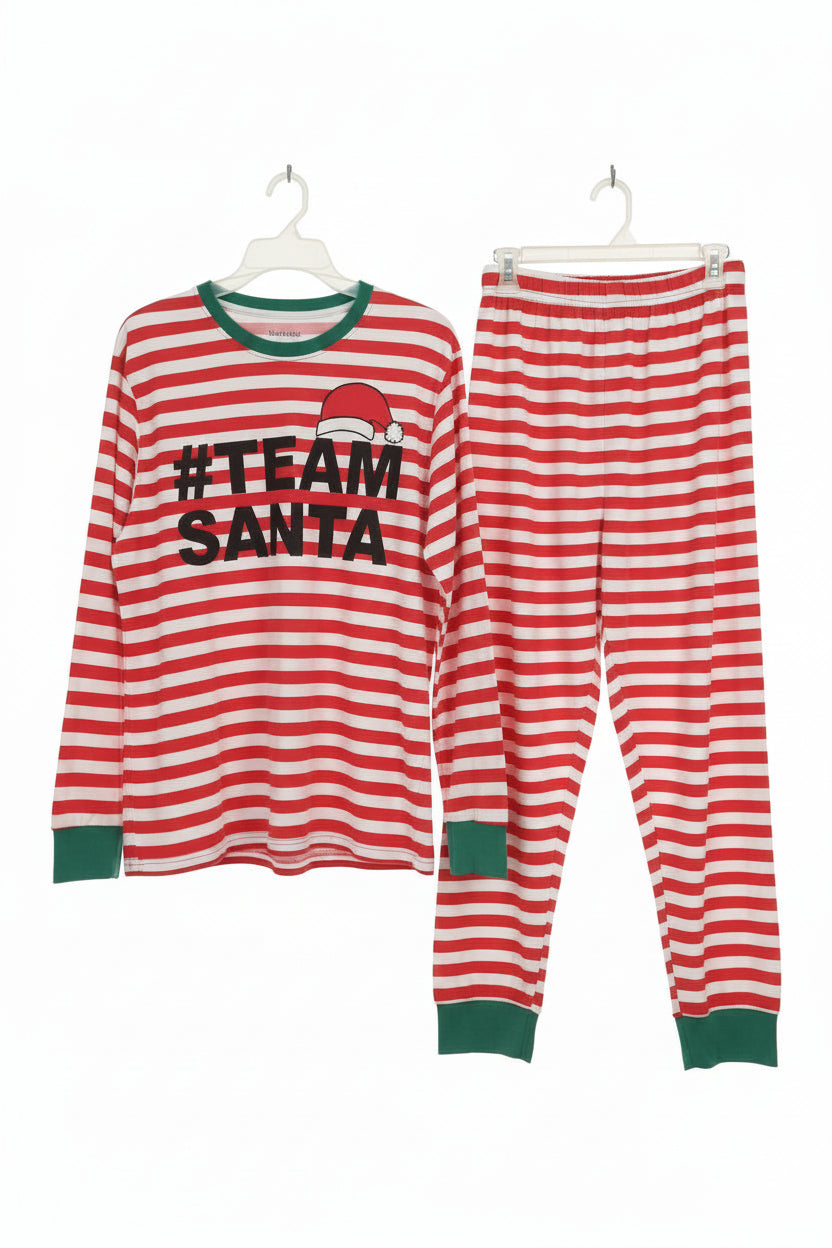 Red and white striped pajama set with '#Team Santa' text on a wooden background