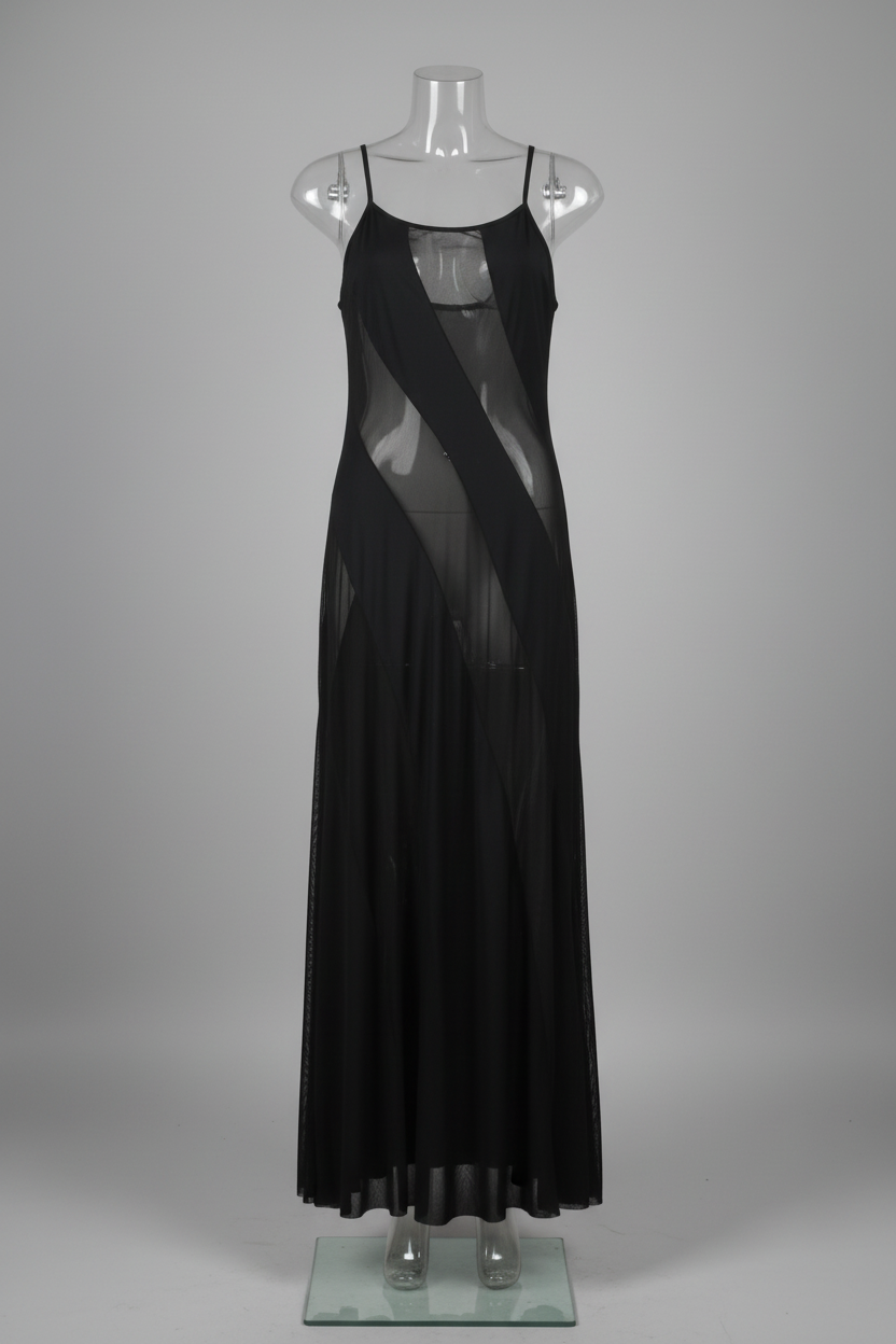 Black dress on a mannequin against a white wall.