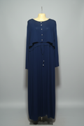 Navy blue dress on a mannequin in a store setting with colorful clothes in the background.