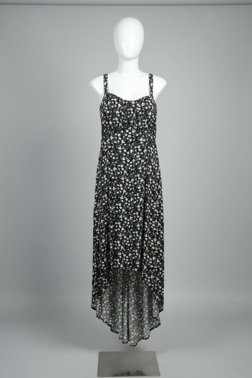 Floral dress on a mannequin against a white wall with a patterned floor.