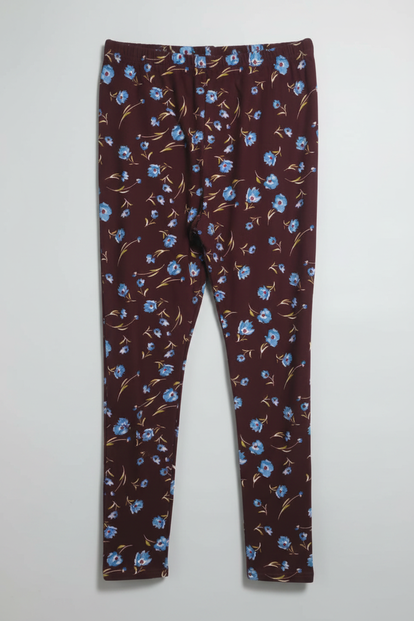Brown leggings with blue floral pattern on a white background