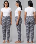 Woman modeling a white top and patterned pants from front, side, and back views on a gray background.