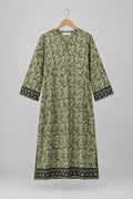 A long-sleeved tunic dress with a dense green and beige floral print, featuring dark patterned trim on the cuffs and hem, hanging on a hanger against a white wardrobe door.