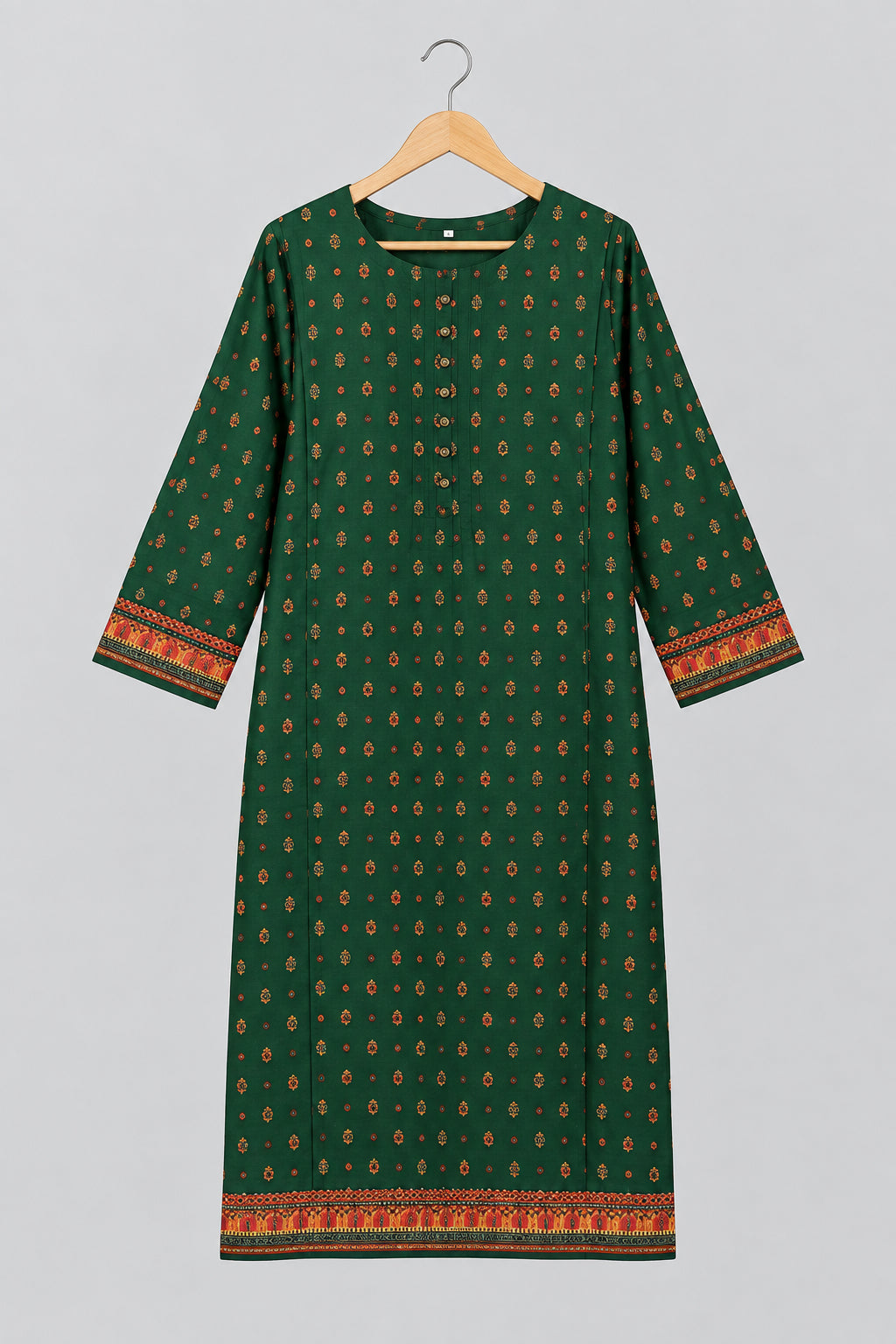A dark green kurta with a small orange and yellow pattern, hanging on a metal hanger against a white wardrobe door.